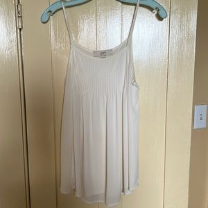 Pristine off white camisole with great front detail!